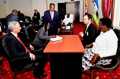 Evelyne Anite, investment minister on behalf of Uganda government signing the joint venture agreement between Uganda Printing and Publishing Corporation and Veridos Identity Solution, a Germany company
